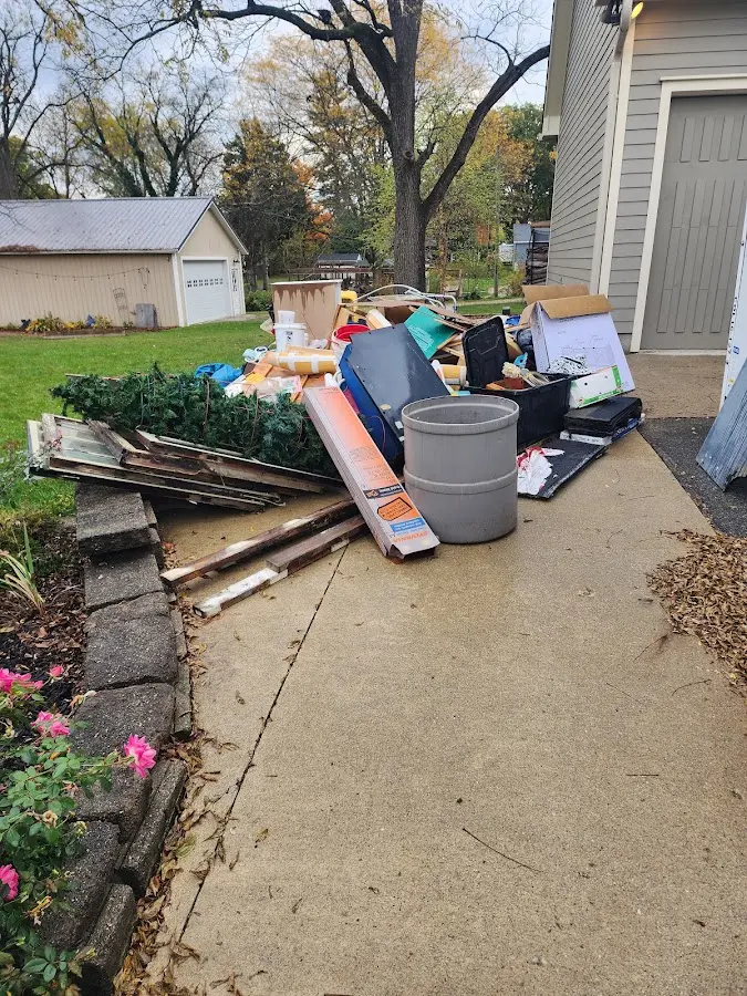 Dumpster being loaded with debris for Residential Dumpster Rental in Eustis